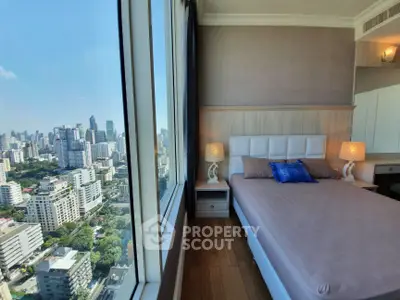 Luxurious bedroom with stunning city view in modern high-rise apartment