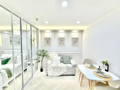 Stylish modern living room with elegant decor and cozy dining area, perfect for urban living.