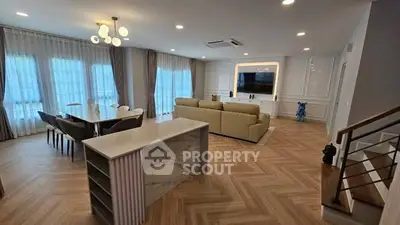 Spacious modern living room with elegant dining area and stylish decor