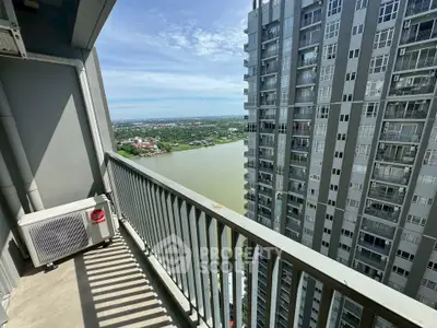 Stunning high-rise balcony with panoramic river and city views, perfect for urban living enthusiasts.