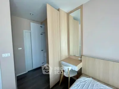 Modern bedroom with sleek wooden furniture and built-in wardrobe
