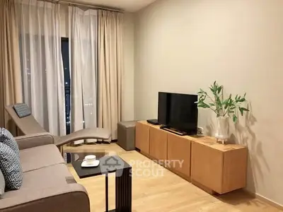 Modern living room with sleek furniture and cozy ambiance, perfect for relaxation and entertainment.