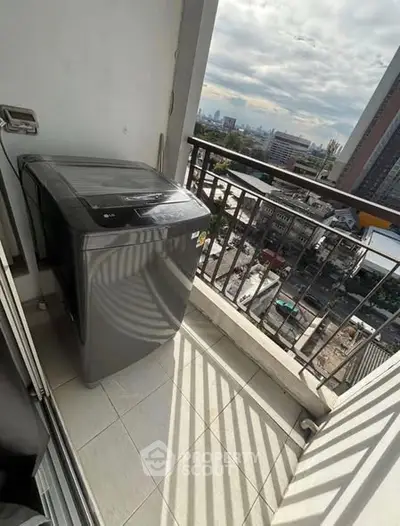 Urban balcony with washing machine and city view, perfect for modern living convenience.