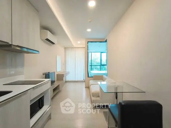 Modern living room with sleek design and large window for natural light.