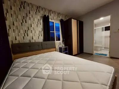 Modern bedroom with stylish decor and ensuite bathroom