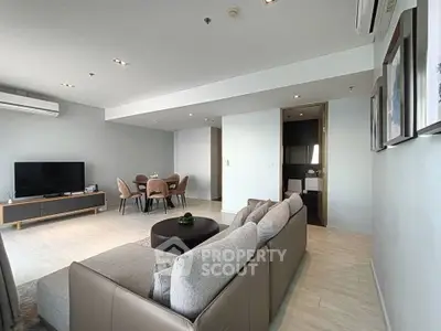 Spacious modern living room with elegant dining area and cozy seating.