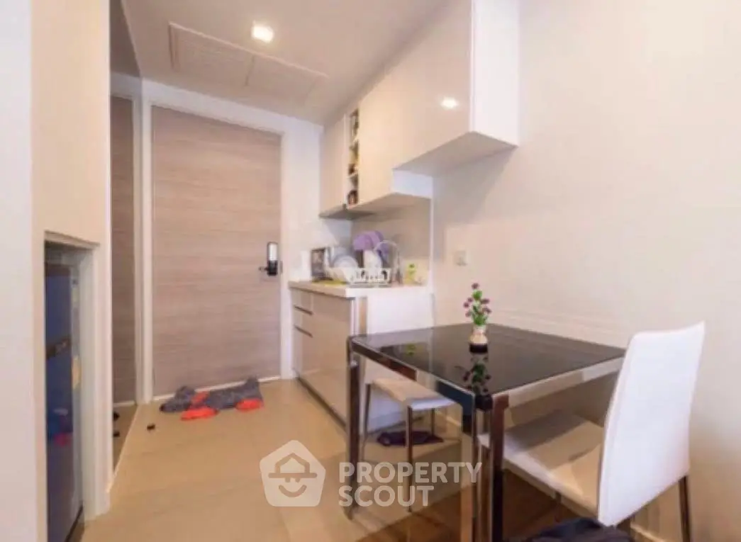 Modern kitchen with sleek dining area and compact design