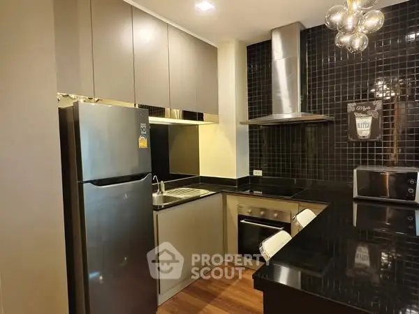Modern kitchen with sleek cabinets and stainless steel appliances
