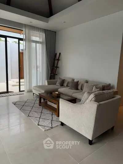 Spacious modern living room with elegant decor and natural light