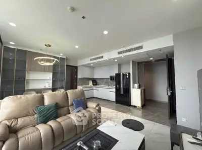 Spacious modern living room with open kitchen and elegant furnishings