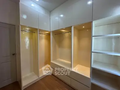 Spacious walk-in closet with modern shelving and ample storage space