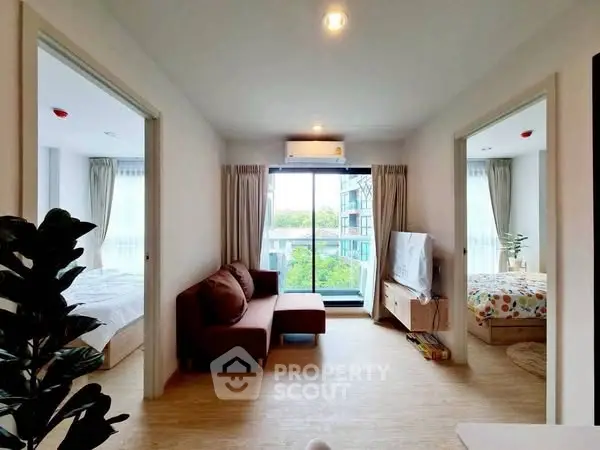 Modern living room with natural light and cozy decor in urban apartment