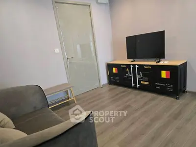 Modern living room with sleek TV stand and cozy sofa