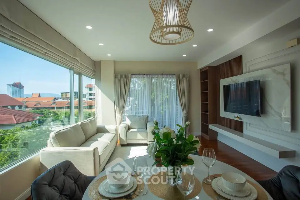 Luxurious living room with modern decor and stunning city view