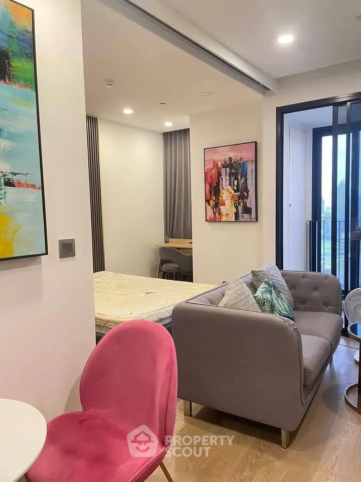 Modern living room with stylish decor and balcony view in urban apartment