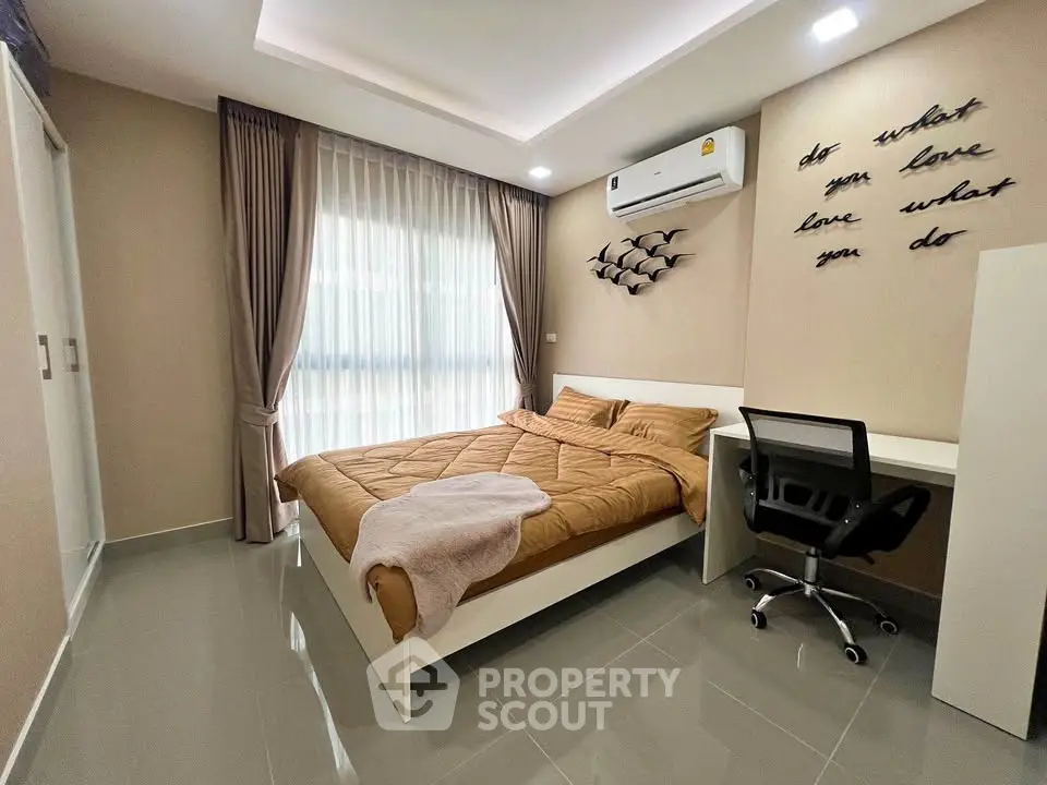 Modern bedroom with sleek design and cozy ambiance, featuring a stylish desk and comfortable bed.