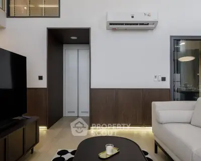 Modern living room with sleek design and air conditioning unit