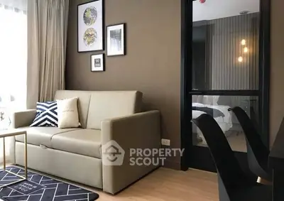 Modern living room with stylish decor and cozy seating in a contemporary apartment.