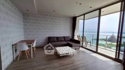 Modern living room with stunning ocean view and spacious balcony
