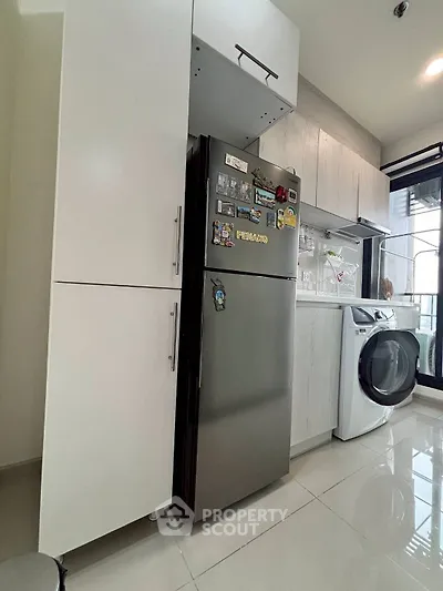 Modern kitchen with sleek appliances and ample storage space