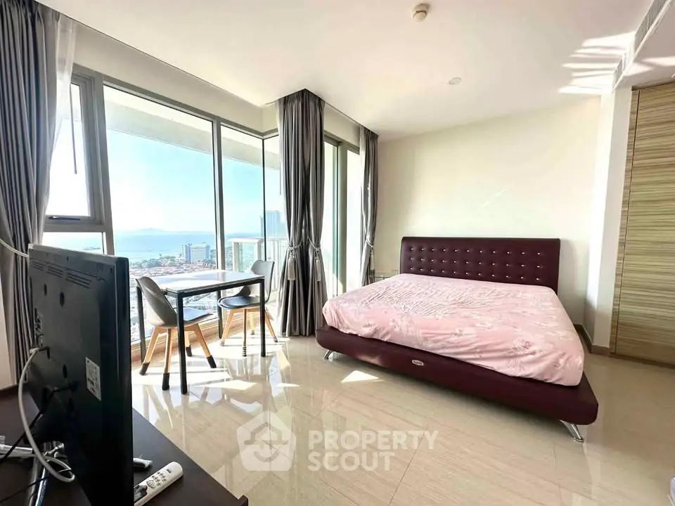 Spacious bedroom with stunning city view and modern furnishings