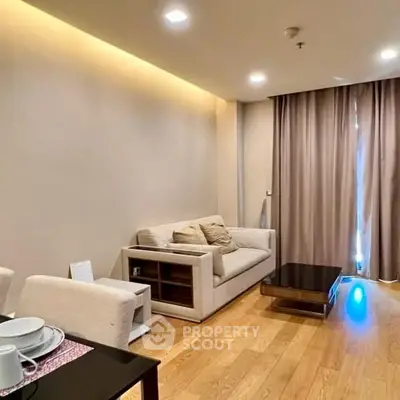 Modern living room with cozy sofa and elegant lighting