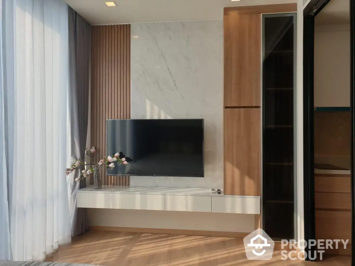 Modern living room with wall-mounted TV and elegant decor