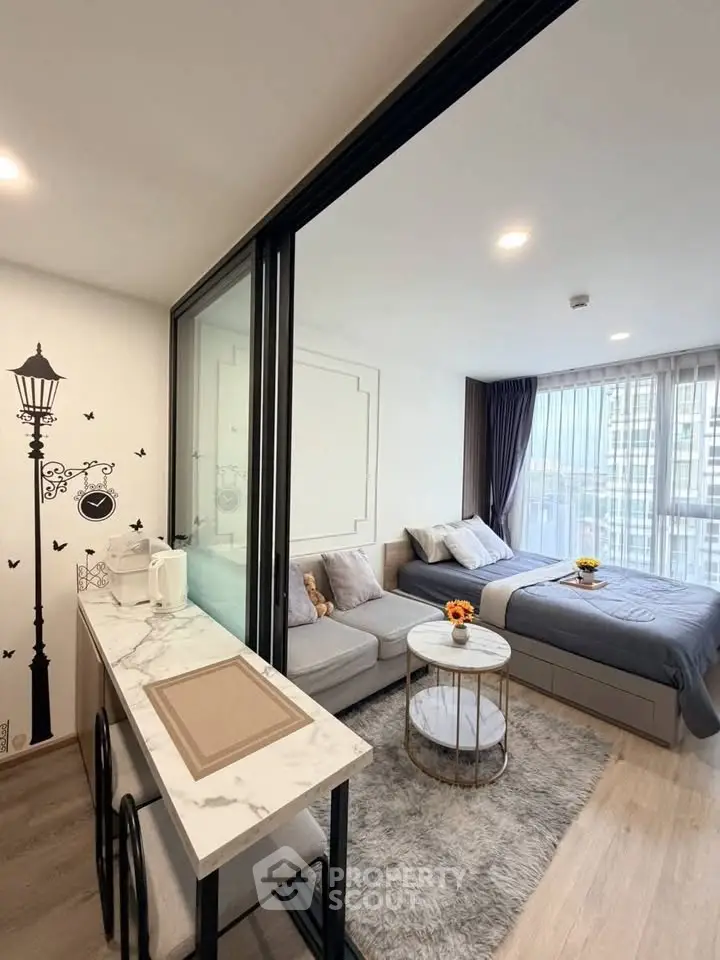 Modern studio apartment with stylish decor and cozy sleeping area