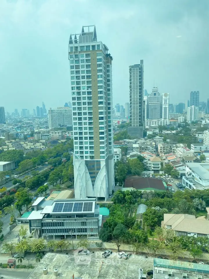 Stunning cityscape view featuring modern high-rise buildings and lush greenery.
