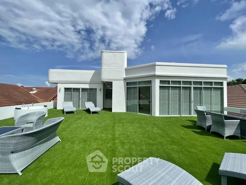 Luxurious rooftop terrace with modern outdoor furniture and stunning views