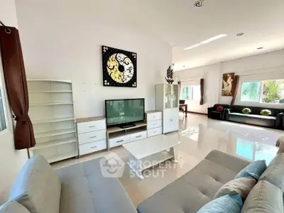 Spacious modern living room with sleek furniture and abundant natural light