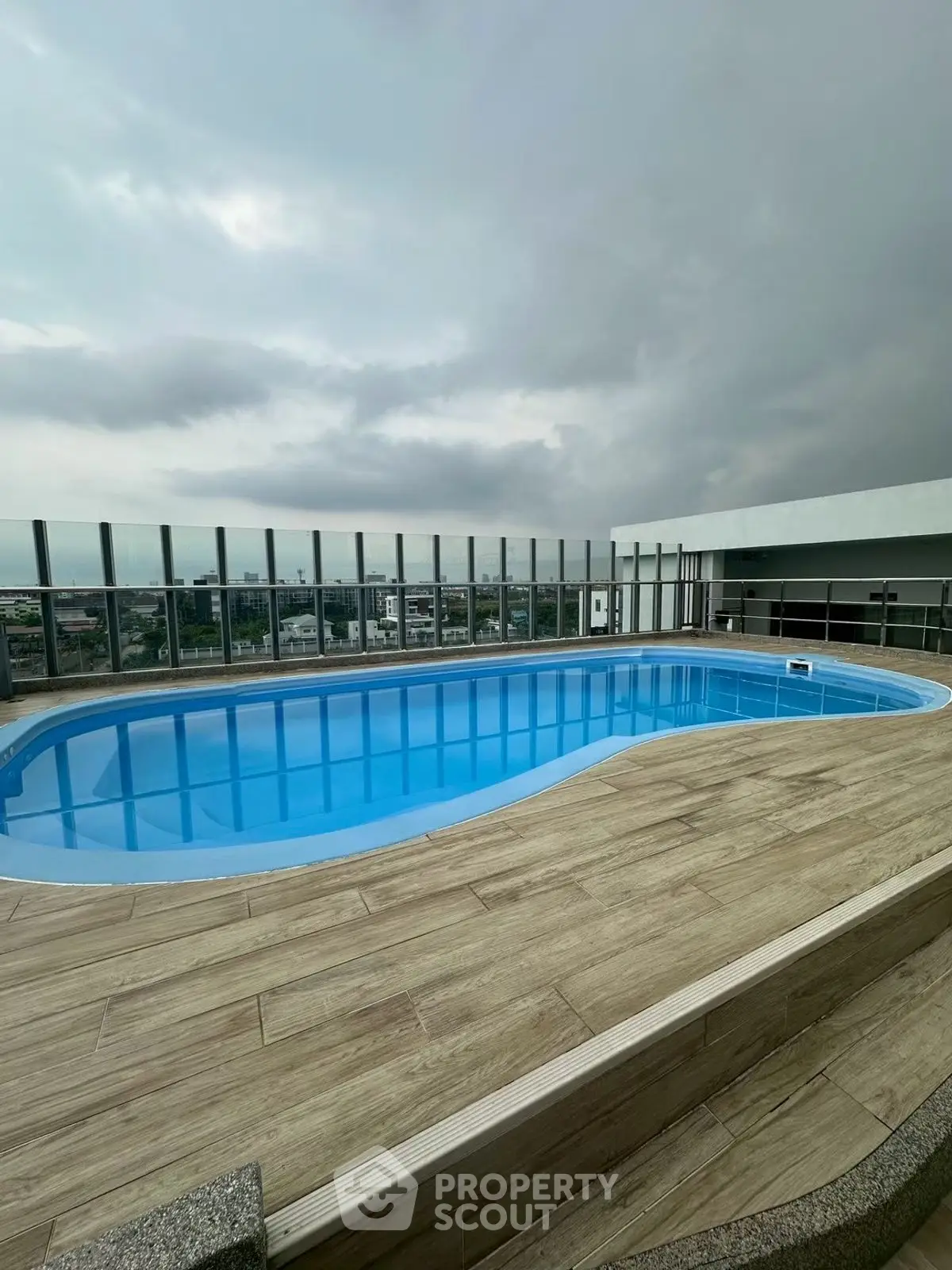 Stunning rooftop pool with panoramic city views, perfect for relaxation and leisure.