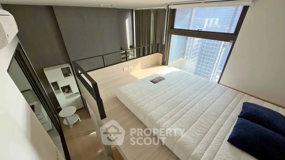 Modern loft bedroom with city view and stylish interior design