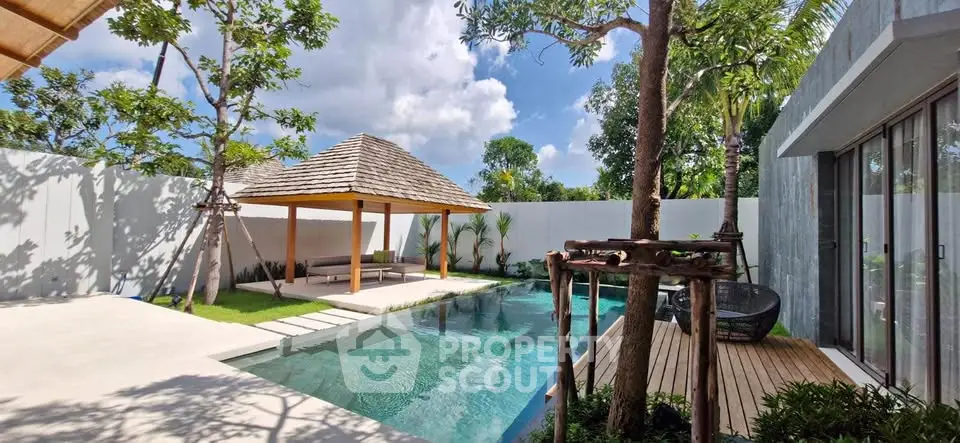Luxurious villa with private pool and tropical garden oasis, perfect for relaxation and entertainment.