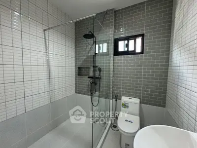 Modern bathroom with sleek glass shower and stylish tile design