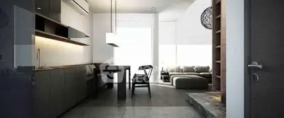 Modern open-plan living room with sleek kitchen and stylish furniture