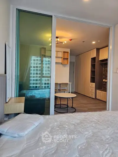 Modern apartment interior with sliding glass doors and stylish furnishings