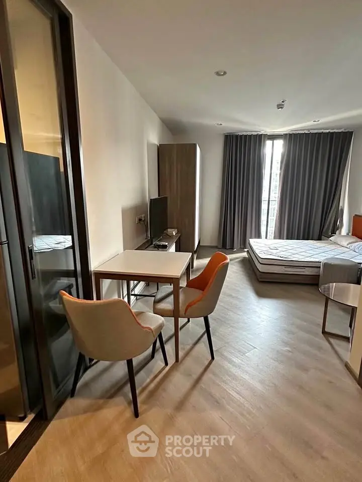 Modern studio apartment with stylish furniture and natural light, perfect for urban living.