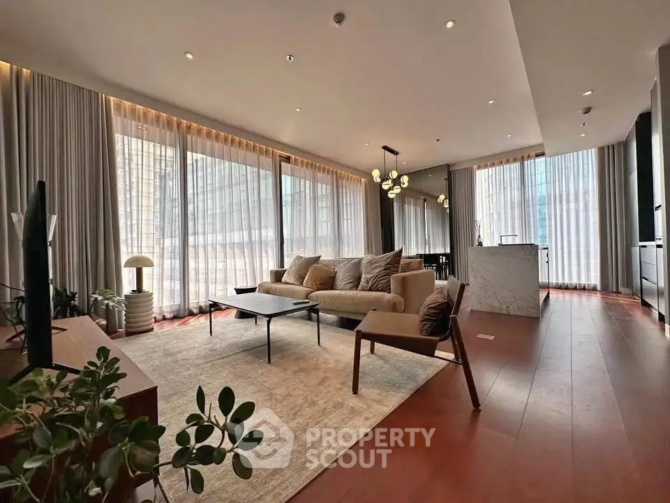 Luxurious modern living room with floor-to-ceiling windows and elegant decor
