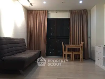 Modern living room with cozy sofa and dining set, featuring floor-to-ceiling windows and elegant curtains.