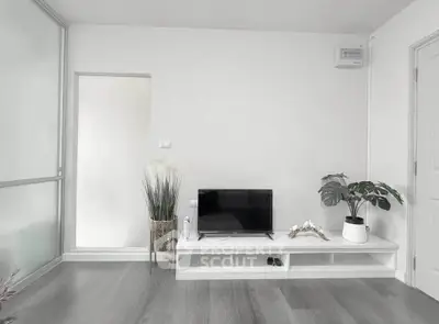 Modern minimalist living room with sleek TV stand and stylish decor