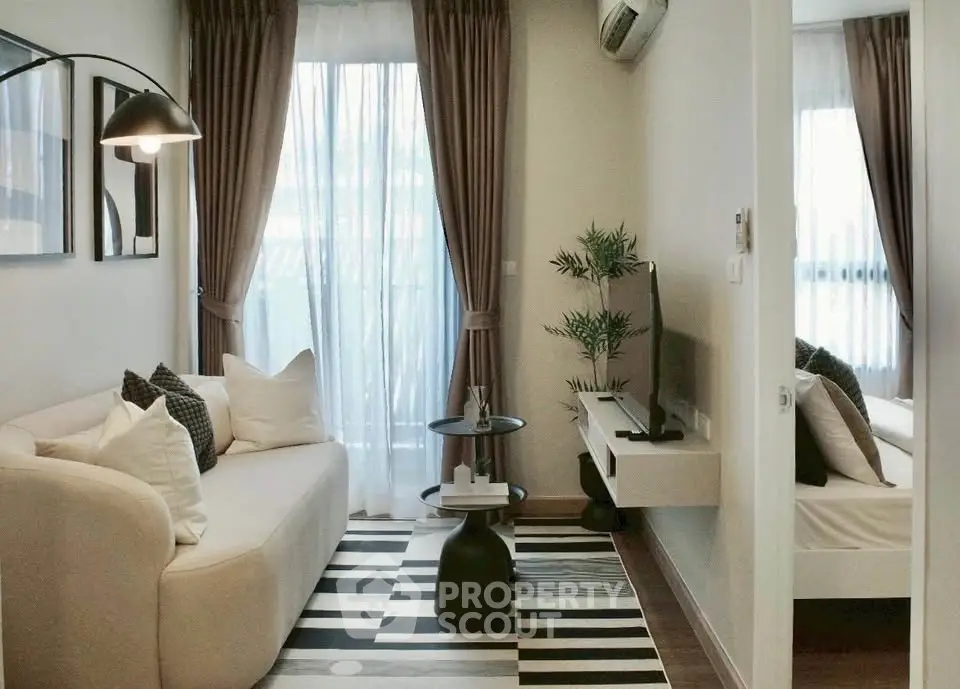 Chic modern living room with cozy sofa, stylish decor, and natural light, perfect for urban living.