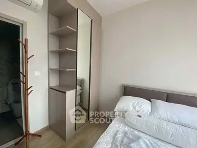 Modern bedroom with sleek wardrobe and air conditioning, perfect for comfortable living.