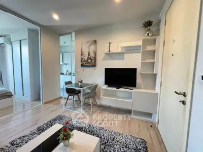 Modern living room with stylish decor and open kitchen layout