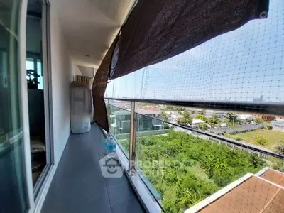 Spacious balcony with scenic view and privacy screen in modern apartment