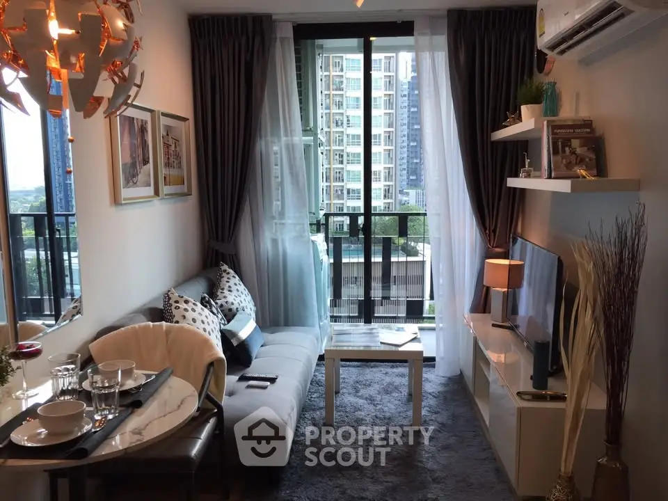 Modern living room with balcony view in high-rise apartment