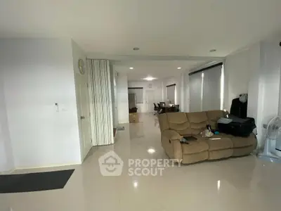Spacious living room with modern decor and comfortable seating