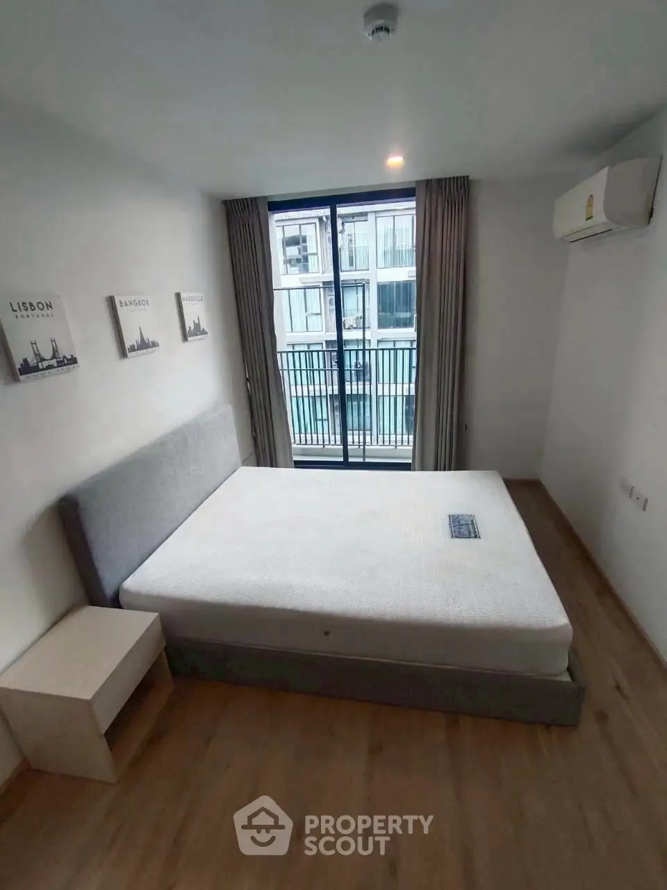 Modern bedroom with balcony view in urban apartment