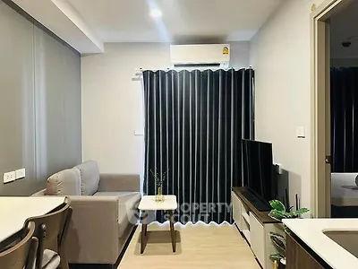 Modern living room with sleek furniture and natural light, perfect for urban living.