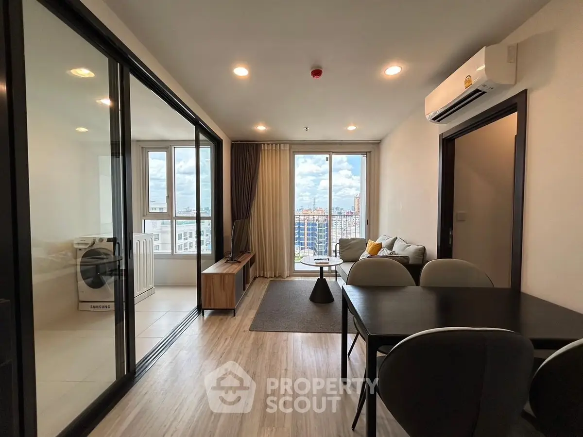 Modern living room with city view, open layout, and stylish decor